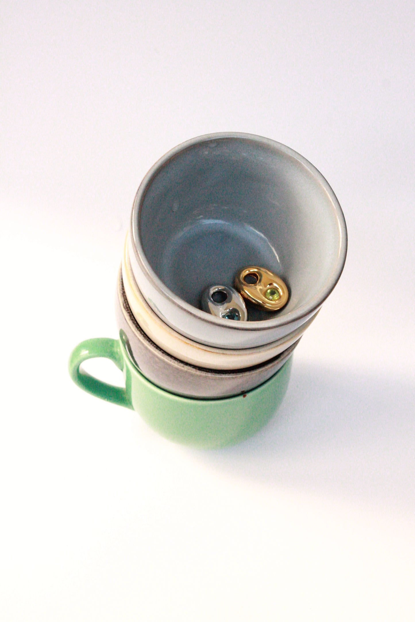 Earrings in teacups
